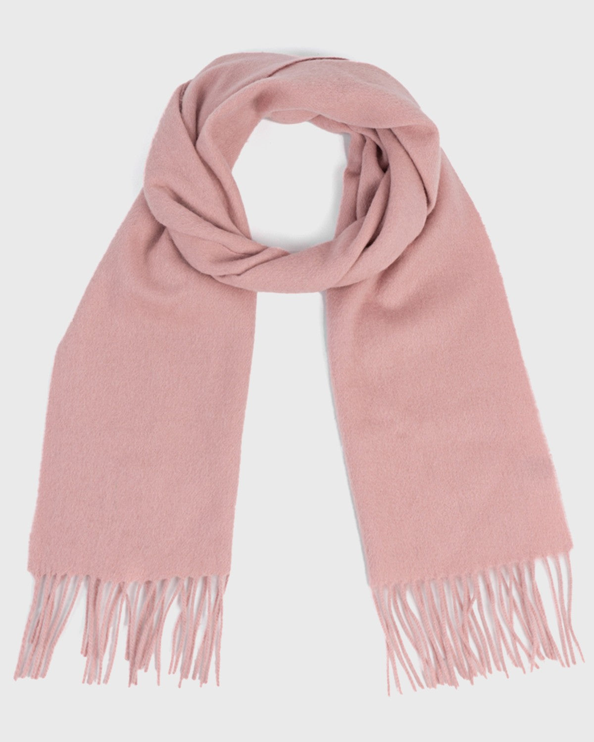 A cozy pink winter scarf featuring stylish fringes, perfect for keeping warm during the colder months.