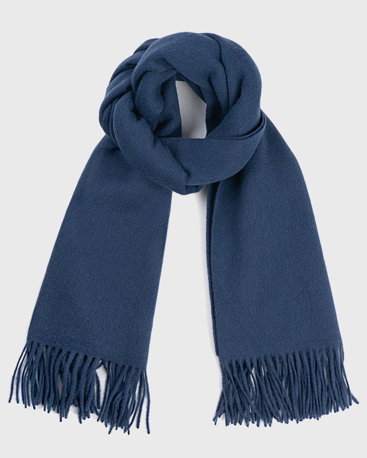 A luxurious navy blue wool scarf elegantly draped, showcasing its soft texture and refined style.