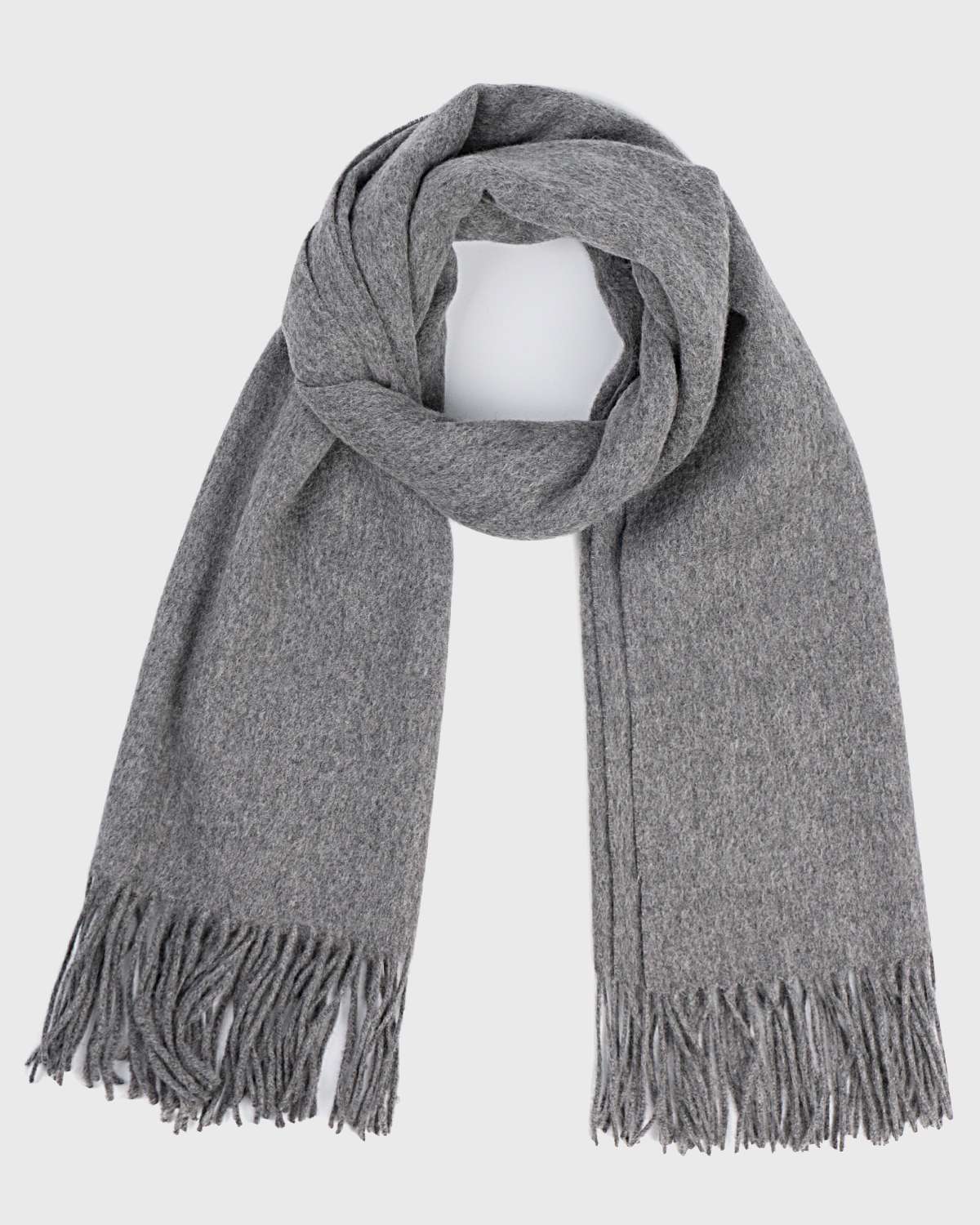 A grey winter scarf with fringes, elegantly draped, showcasing its soft texture and stylish design.