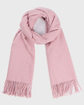 A pink scarf with fringes, elegantly draped, showcasing its soft texture and vibrant color.