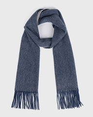 A reversible blue wool scarf with fringes, showcasing a soft texture and elegant design.