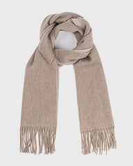 A khaki reversible scarf featuring fringes, elegantly draped to showcase its soft khaki texture.