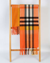 A wooden ladder leaning against a wall, adorned with a colorful scarf draped over one of its rungs.